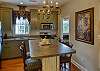 The kitchen & door to RIGHT leads to 1 of 2 bathrooms & bedrooms.