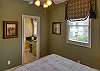 Queen bed & bathroom door to en suite bathroom