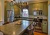The Carriage House kitchen includes all appliances and seating for 4 at the spacious island.