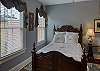 This 3rd queen bedroom is located on 2nd floor & has full, en suite bathroom, closet & smart TV.