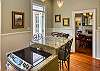The kitchen Island seats 3 and this is the electric, glass top stove/oven.