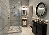 The 1st Floor bathroom features spacious, granite walk-in shower, off the attached queen bedroom