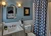 Full bathroom with tub/shower combo off 2nd bedroom
