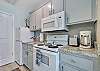 Galley kitchen on 56 Side. All appliances included except dishwasher. 
Washer & dryer are in garage on 56 side.