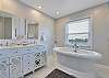 LUX bathroom on 56 side. Deep, soaking tub with views galore!
Double vanity, walk-in shower & walk-in closet.