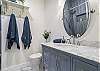 The master bathroom has a beautifully tiles walk-in shower. Brand new tile floors and vanity finish the space nicely.