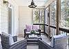 Nestled in the Jasmine blooms, is the screened front porch!