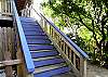 The owner's have painted the steps and trim of the home in cheery lavender which welcomes you to the entrance.