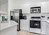 Spacious and clean kitchen with quartz countertops and all the appliances needed to whip up dinner or just a cup of joe!