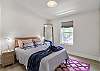 The second bedroom has a queen size bed, closet and full length mirror.