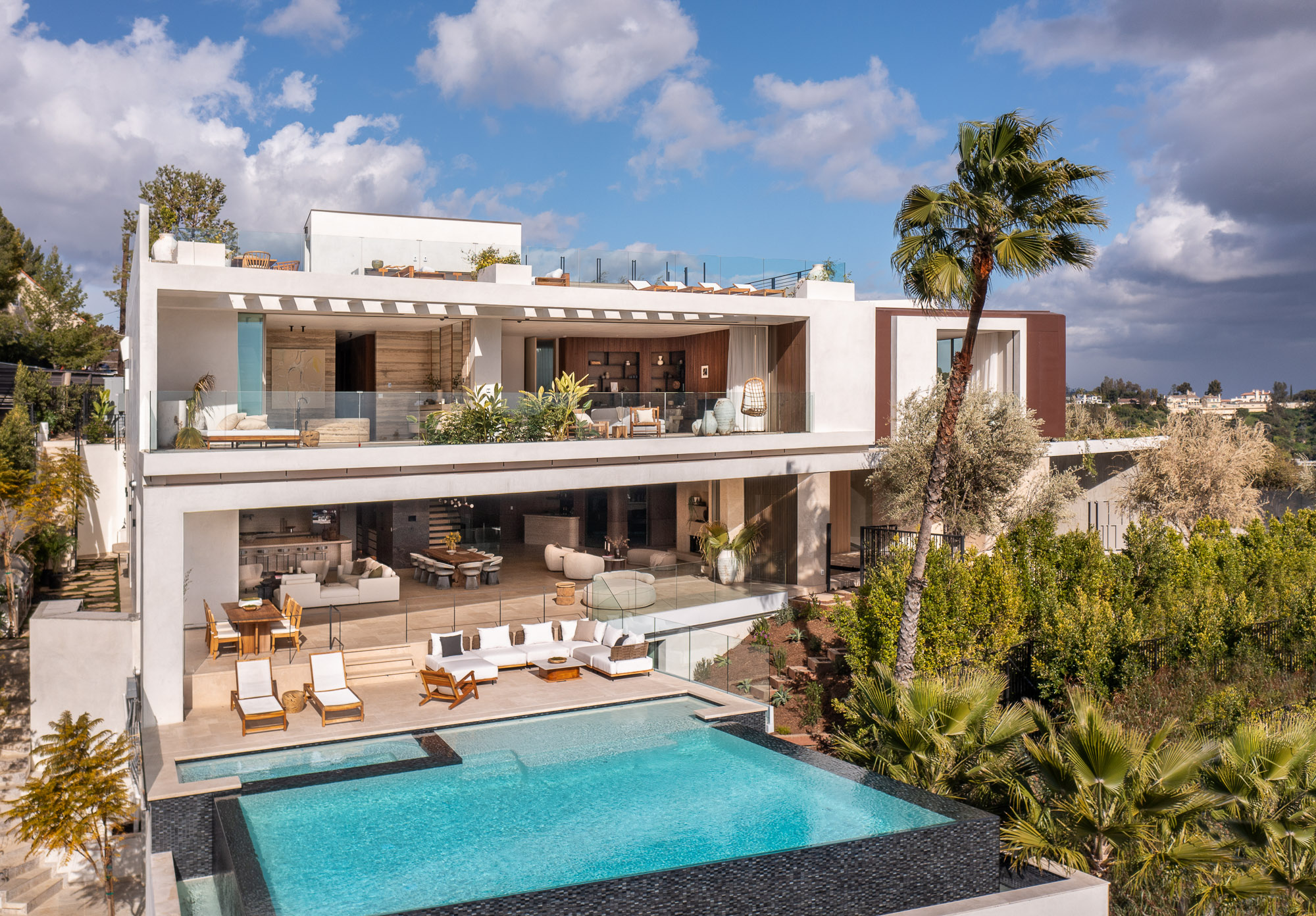 A gated Bel Air estate above Stradella Road, its pool terrace opening to the canyon below