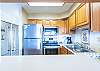 Stainless steel appliances in kitchen including dishwasher
