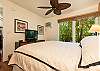 Master bedroom has garden view, flat-screen TV