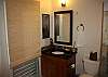 Guest bathroom also has stacked washer/dryer