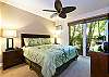 Guest bedroom has ample lighting with garden view