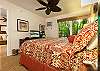 Master bedroom with garden view and flat screen TV
