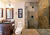 Slate step-in shower in guest bathroom