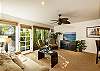 Flat screen TV and plenty of natural light in the living room