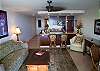 Living room has AC and an overhead fan to keep you cool