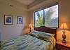 Queen bed in guest bedroom