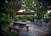 Multiple grills offered on site, along with bench dining seating.