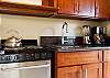 Fully appliance'd kitchen has microwave, coffee maker, blender, and more