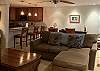 Comfortable living room with tropical views - islands, ocean & mountains can all be seen from this condo