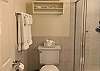 Guest bathroom with corner step-in shower