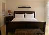 One of the guest bedrooms, with full-size bed