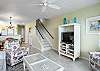 Living area with stairs leading to bedrooms