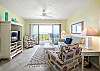 Living Area with new tile floors and swivel glider rockers