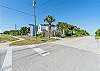 Sidewalk in front of house simply follow past next home and down the residential side street straight down until your feet are in the sand