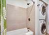 Unit A - second bathroom located off hallway - includes washer and dryer