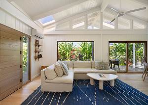 Bright living space with lush tropical views