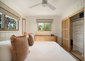 Closet with lots of space and dresser for storage 