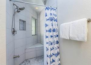 Upstairs bathroom with tiled shower