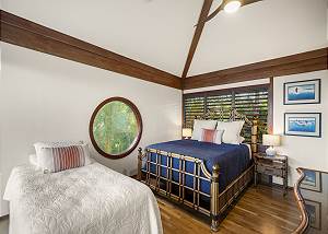Queen bed and twin bed with pool and ocean views