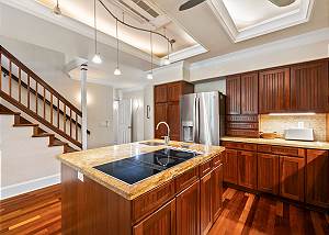 The kitchen is just off the front entrance of the home