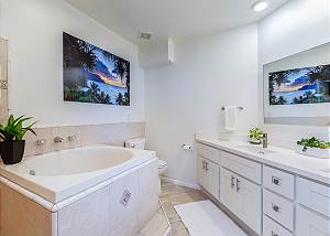 Full bathroom with shower and a soaking tub 
