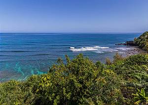 Watch the surf on the covered lanai from this unit.