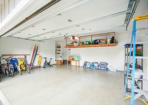 Two car garage with lots of beach gear