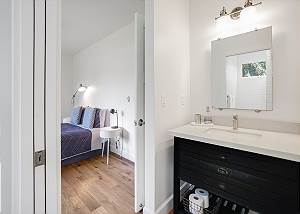 Two guest rooms share a Jack and Jill bathroom