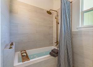 Enjoy a luxurious bath or shower in the master bathroom.