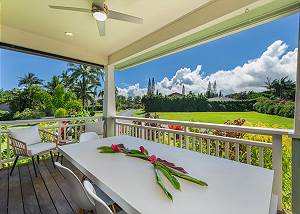 Large front lanai overlooking lush landscaping and majestic moun