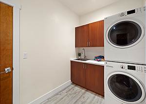 Laundry room next to garage