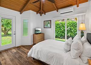 Guest room surrounded by lush tropical greenery