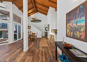 Gorgeous hard-wood floors and vaulted ceilings