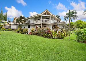 Beautiful Hawaiian tropical landscaping surrounds this gorgeous 