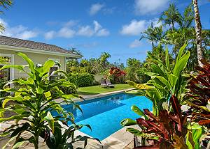 Surrounded by lush tropical landscaping