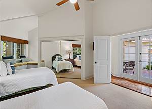 French doors leading to the pool outside and a reading nook in t